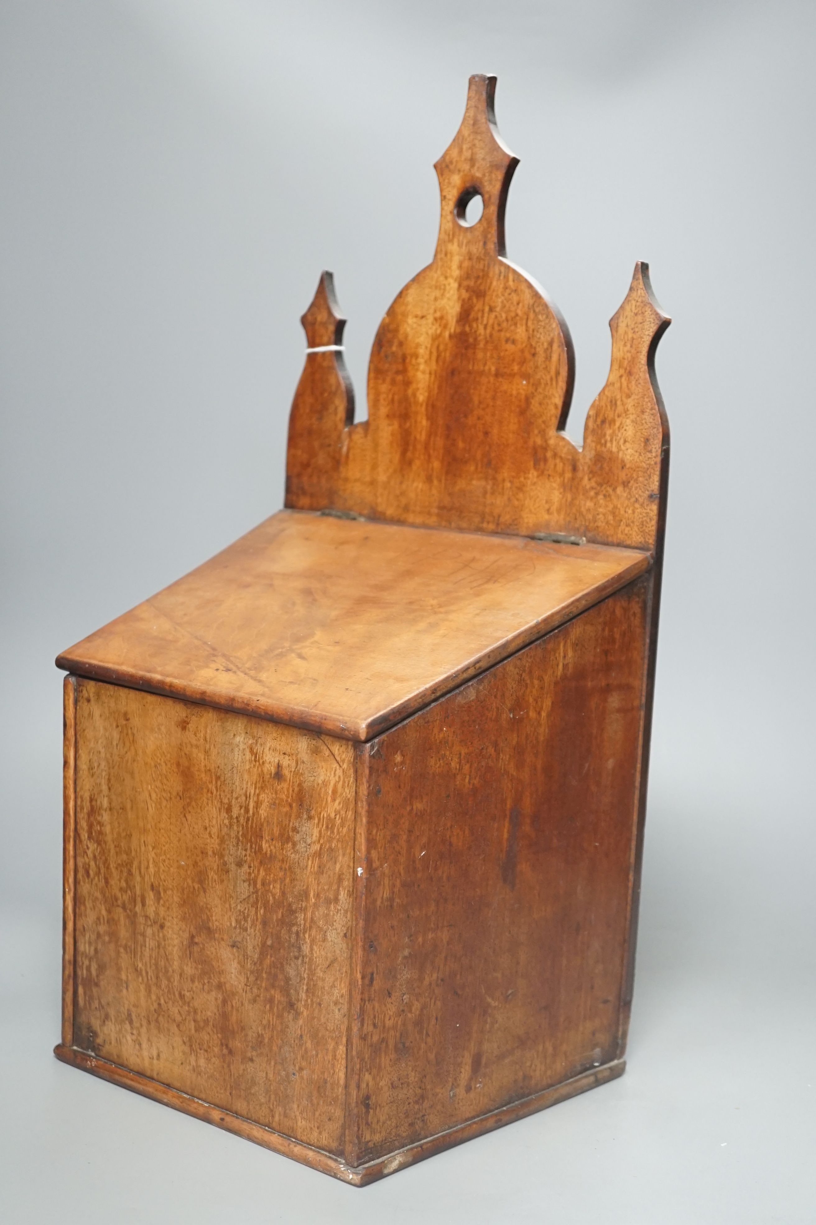 A George III mahogany salt box, 49.5 cms high.